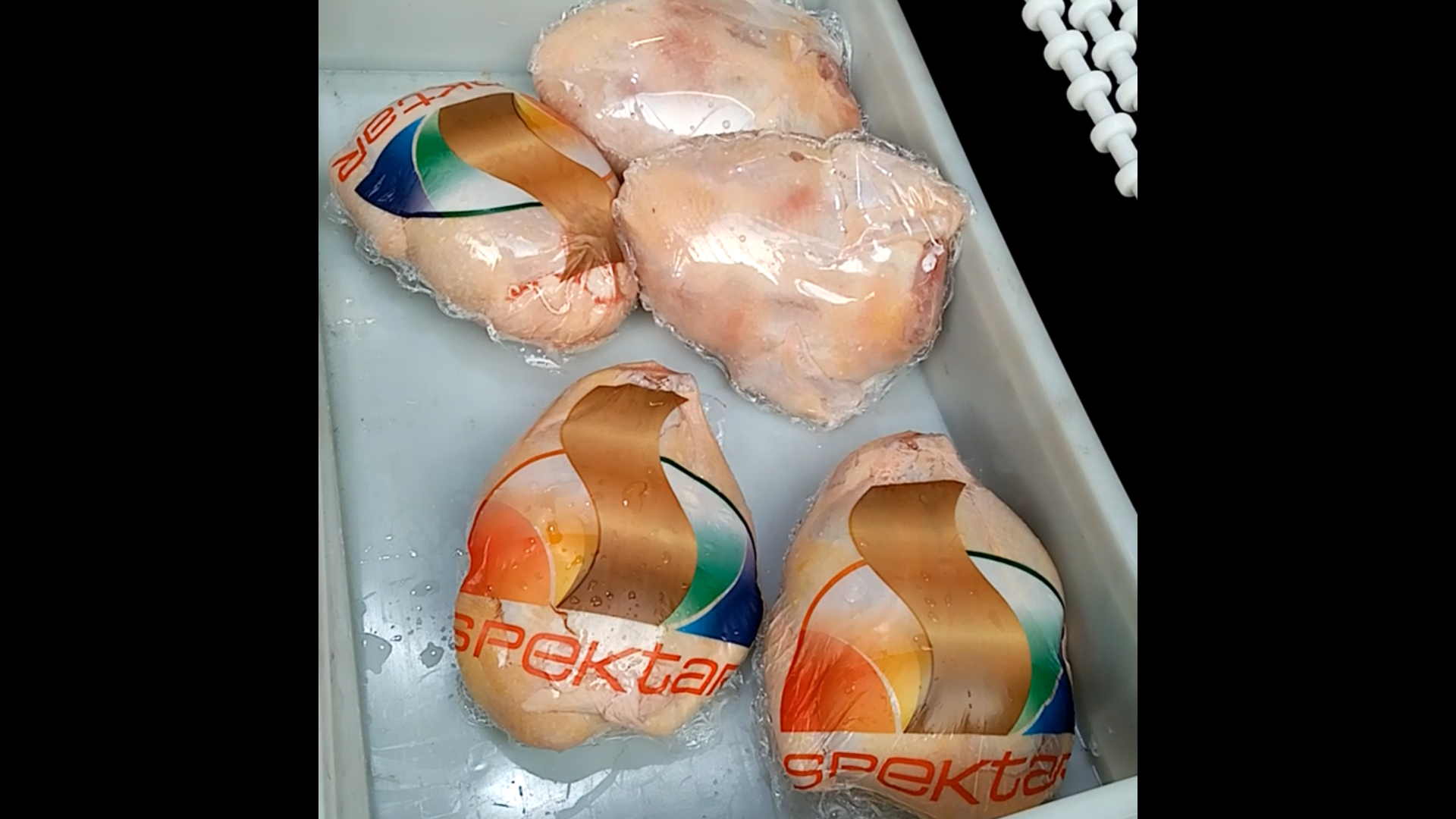 Whole chicken packed in shrink films